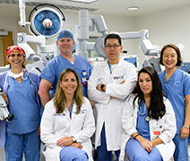 Photo of the robotic surgery team. Links to What to Give