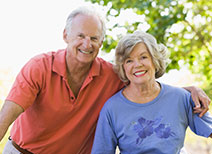 Photo of a man and woman on bicycles. Link to Life Stage Gift Planner Ages 60-70 Situations.