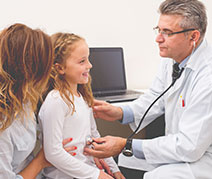 Photo of a doctor with a patient. Link to Gifts of Cash, Checks, and Credit Cards